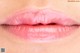 a close up of a woman's lips with a pink lipstick