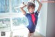 A woman in a sailor outfit is posing for a picture.